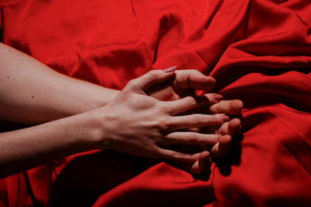 Couple sensual touch. Romantic couple holding hands. Hands of lovers. Hands of love. Couple in love. Sensual hands concept. Tender couple. Romance.の写真素材