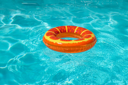 Summer holiday background. Summer backdrop. Beach toy. Ring float in swimming pool. Summertime vacation. Rubber circle. Inflatable swimming ring.の写真素材
