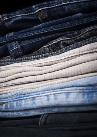 Color texture. Jeans fabric texture. Blue denim jean background. Jeans texture or denim background. Jeans with pockets, rivets, buttons, seams.の写真素材