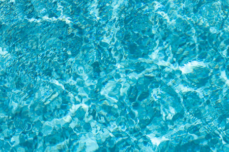 Background of pool water surface. Abstract blue water. Background texture. Water in swimming pool.