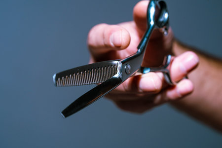 Barber shop. Man holding scissors. Barber scissors, barbershop. Barber scissors vintage barbershop.