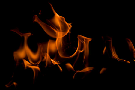 Fire flames on black background. Blaze fire flame texture. Fire flame with copy space. Blaze fire flame textured background. Flames on black background.の写真素材