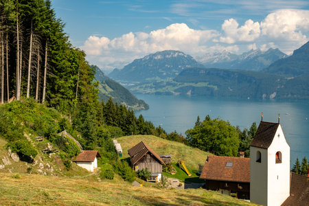 Scenic landscape background. Swiss alps and lake landscape. Switzerland landscape. Swiss mountains and lake. Idyllic scenery in the Alps with fresh green meadows. National Park. Hiking and traveling.の写真素材