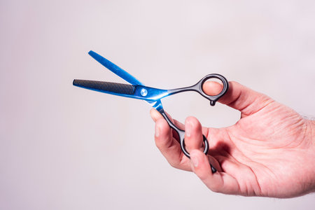 Barber shop. Man holding scissors. Barber scissors, barbershop. Barber scissors vintage barbershop.