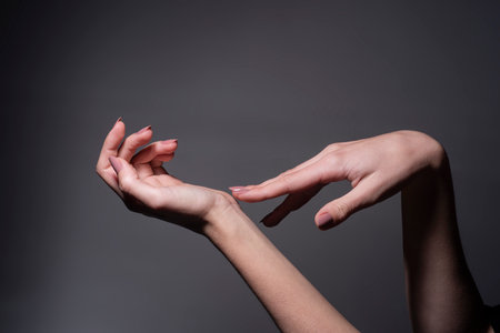 Hands. Hand Skin Care. Female Hands Applying Cream, Lotion. Spa and Manicure concept. Beautiful Woman Hands. Female hands with manicure. Soft skin, skincare concept.の写真素材