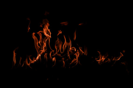 Texture of fire on black background. Texture of fire on a black background. Fire over black...