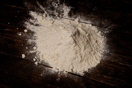 Bakery background. Cook hands. Making dough. Chef with wheat flour. Flour. Baking concept. Prepares pastry. Wheat flour on wooden table.の写真素材