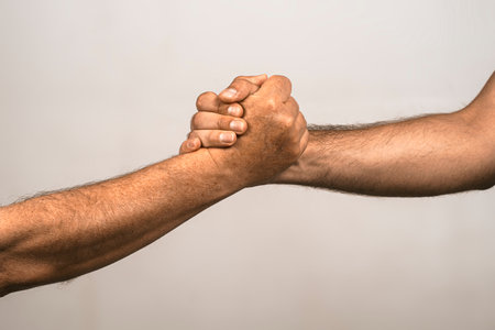 Support hands. Helping support hand. Rescue gesture. Support hand. Concept of support. Strong hold. Two hands, helping hand of a friend. Handshake, arms friendship.の写真素材