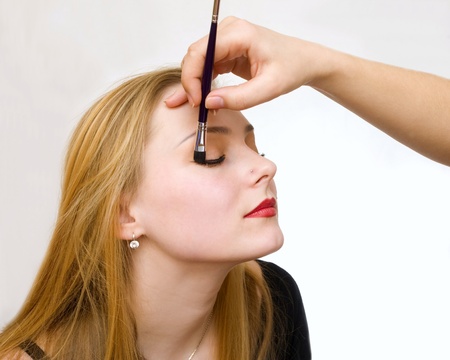 a young girl remedies a make-upの写真素材