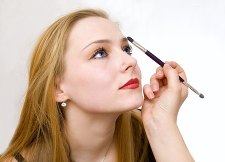 a young girl remedies a make-upの写真素材