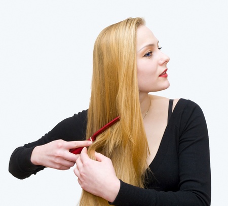 The young girl combs hair a crestの写真素材