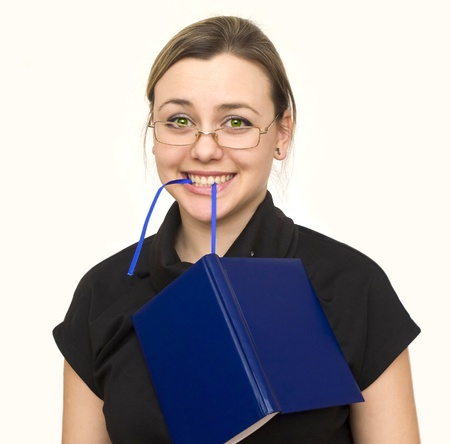 a young girl with a notebook decides business tasksの写真素材