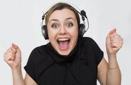a young girl listens music emotionallyの写真素材