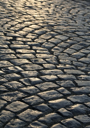 Close-up of the old pavement stones in dark colorsの写真素材