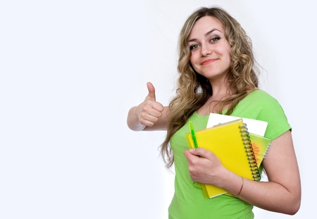 Woman in the green jersey with a notebookの写真素材