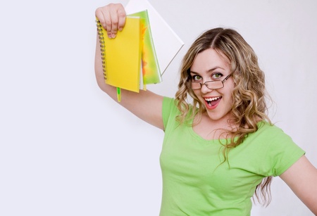 Woman in the green jersey with a notebookの写真素材