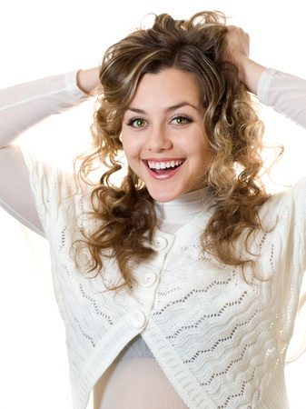 Portrait of an excited young lady celebrating success against white backgroundの写真素材