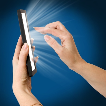 a woman hand holding a touchpad pcの写真素材