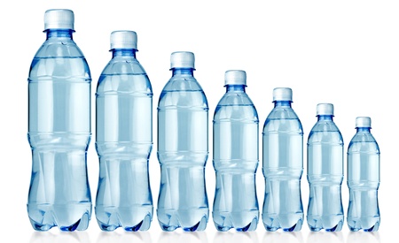 Bottled water in 7 sizes isolated over a white backgroundの写真素材