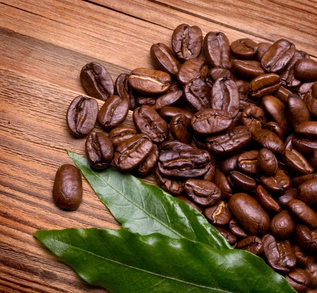 Coffee Beans over Wood Backgroundの写真素材