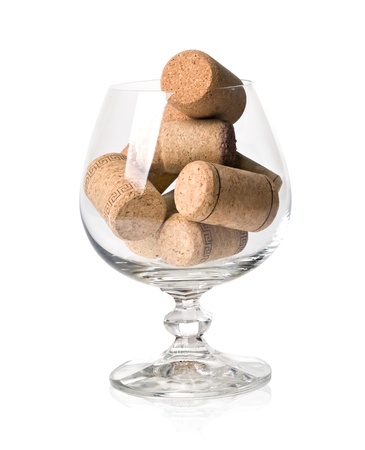 corks in the wine glass isolated on white backgroundの写真素材