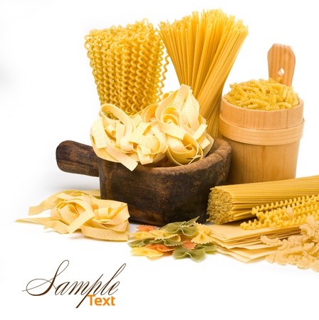 pasta and wooden plate isolated on white backgroundの写真素材