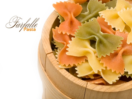 Close-up pasta in a wooden bowl with space for textの写真素材