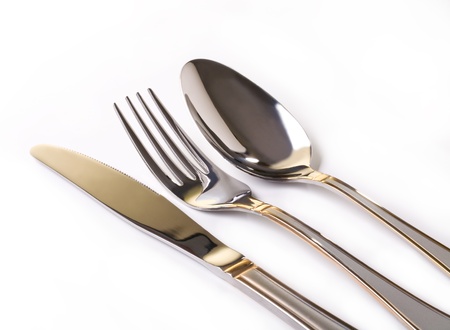 Fork, knife and spoon isolated on white backgroundの写真素材