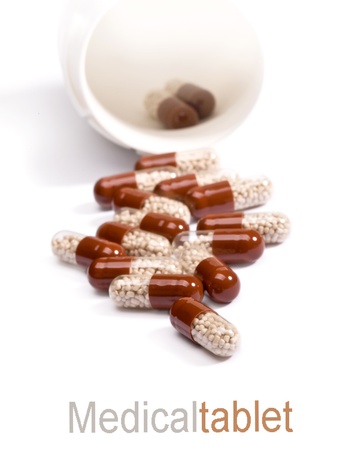 Pills spilling out of pill bottleの写真素材