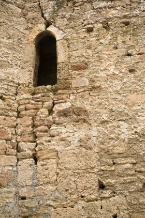castle stone wall with a windowの写真素材
