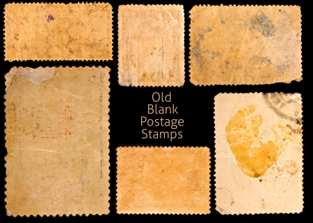 Old postage stamps border on black backgroundの写真素材
