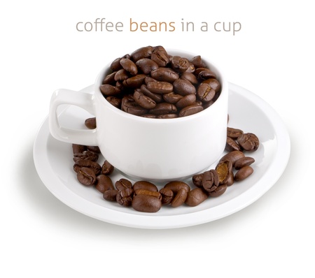coffee beans in a cup isolated on white backgroundの写真素材