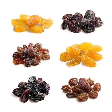 different varieties of raisins on a white backgroundの写真素材