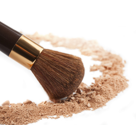 Isolated make-up powder with brush on white background