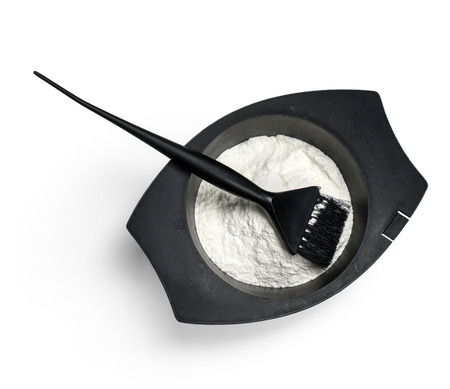 Bowl with peroxide and brush, closeup on whiteの写真素材