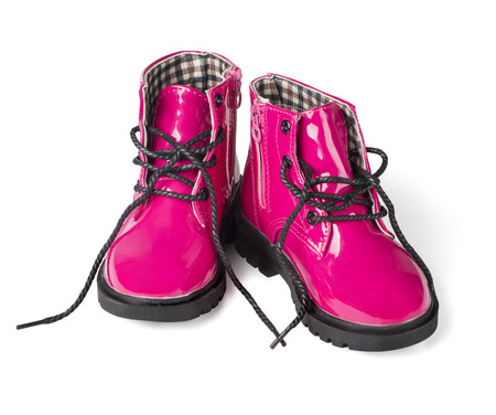 pink child boots white isolated with clipping pathの写真素材