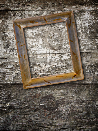 wooden photo frame on old wooden wallの写真素材