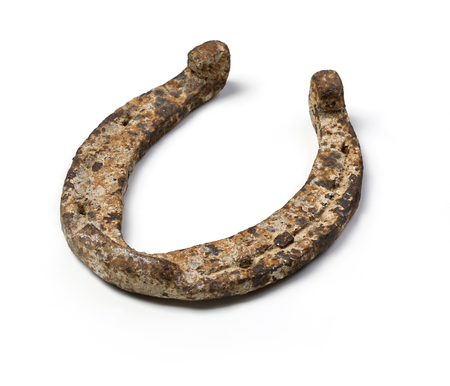 Old horseshoe - a symbol of good luck on white backgroundの写真素材