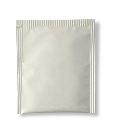 Blank white plastic sachet for medicine, drugs, coffee, sugar, salt, spices, isolated on white background . with clipping pathの写真素材