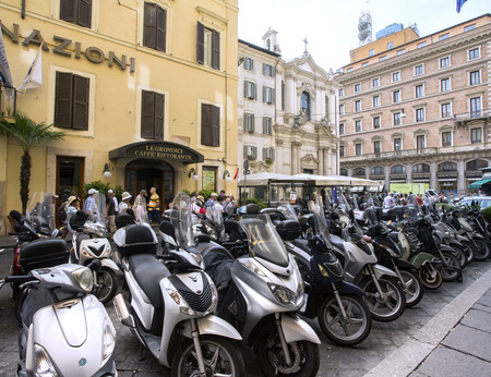 ROME, ITALY, on MAY  06, 2015. Bright scooters are parked on the city streetのeditorial素材