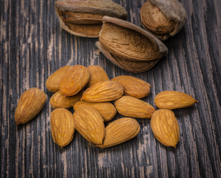 almonds nuts on a wooden tableの写真素材