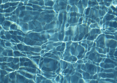 Hotel swimming pool with sunny reflections