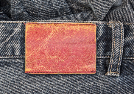 blank  leather label on blue jeans backgroundの写真素材