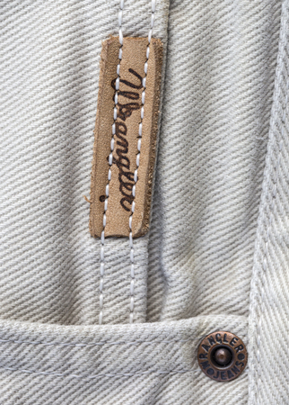 Chisinau, Moldova - August 19, 2016: Closeup of Wrangler label on white jeans. Wrangler is American...