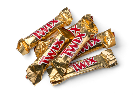 Chisinau, Moldova - September, 27, 2016: Twix wrapper isolated on white. Twix is a chocolate bar made by Mars, Inc., consisting of biscuit applied with caramel and milk chocolate.のeditorial素材