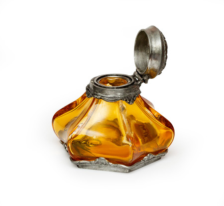 Ornate antique brass inkwell on whiteの写真素材