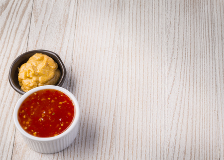 Barbecue sauce  over rustic barn wood table with room for copy space.の写真素材