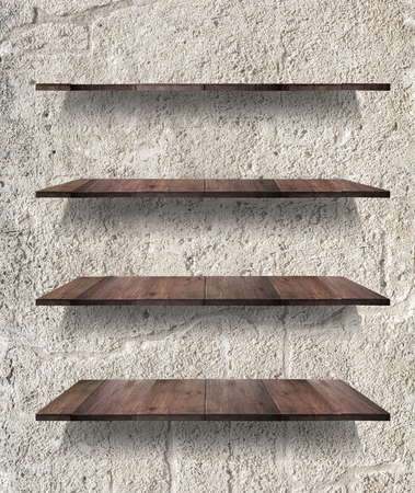 collection of wooden shelves on an concrete backgroundの写真素材