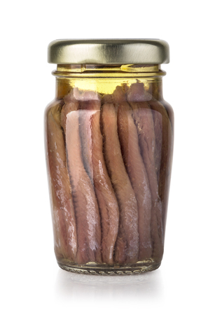 canned fish in glass jar isolated on whiteの写真素材