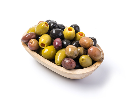 The green and black olives in bowl  on white  background.の写真素材